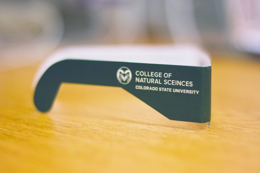 The eclipse glasses given out by CSU from the College of Natural Sciences, with the typo sceinces. (Tony Villalobos May | Collegian)
