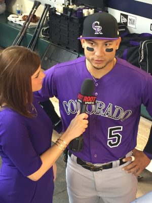CSU Alumnus Jenny Cavnar interviews Rockies outfielder Carlos Gonzalez live on air.