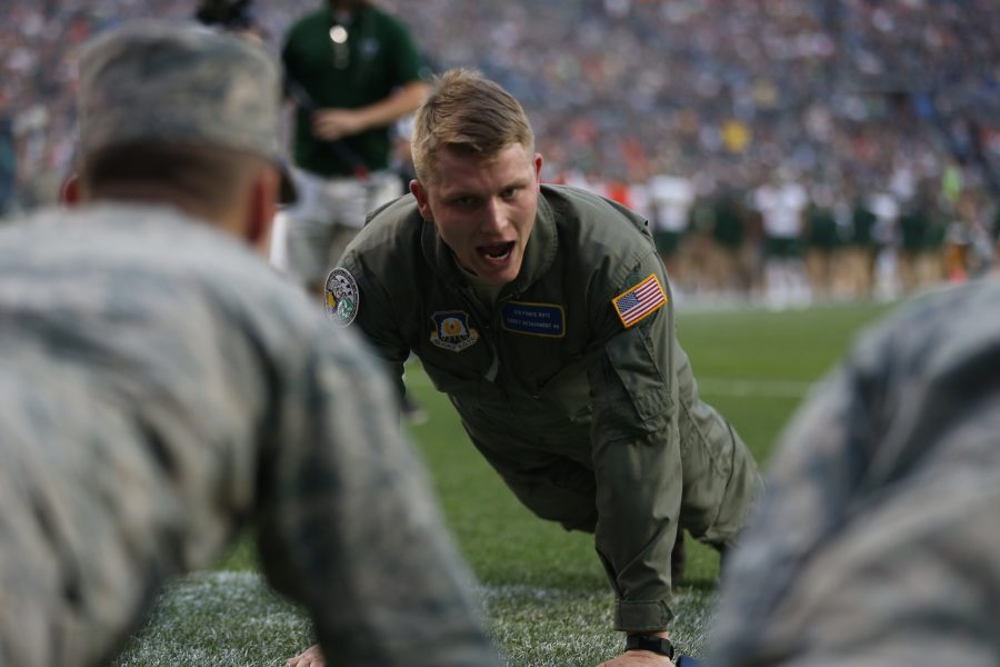 A member of the  Air Force ROTC leads pushups after a Colorado State field goal during the second quarter of the Rocky Mountain Showdown on September 1, 2017 at Mile High Stadium. (Elliott Jerge | Collegian)