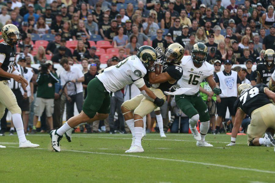 DENVER- Colorado State senior Evan Colorito makes a tackle on a CU player during the first quarter of action during the Rocky Mountain Showdown. The Rams lost 17-3. (Elliott Jerge | Collegian)