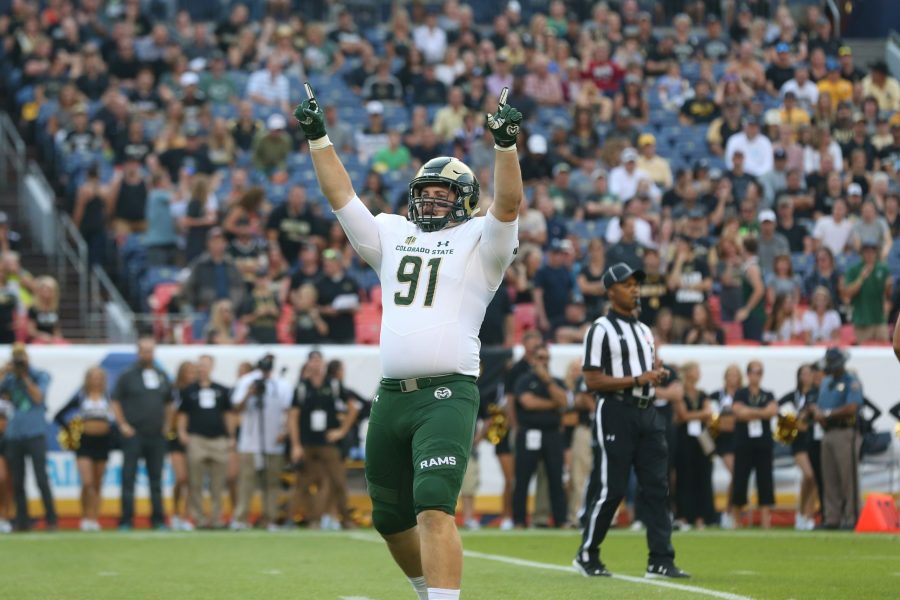 Colorado State Defensive Lineman Jakob Buys celebrates a sank during the first quarter of action against the Colorado Buffalos during the Rocky Mountain Showdown at Mile High Stadium. (Elliott Jerge | Collegian)