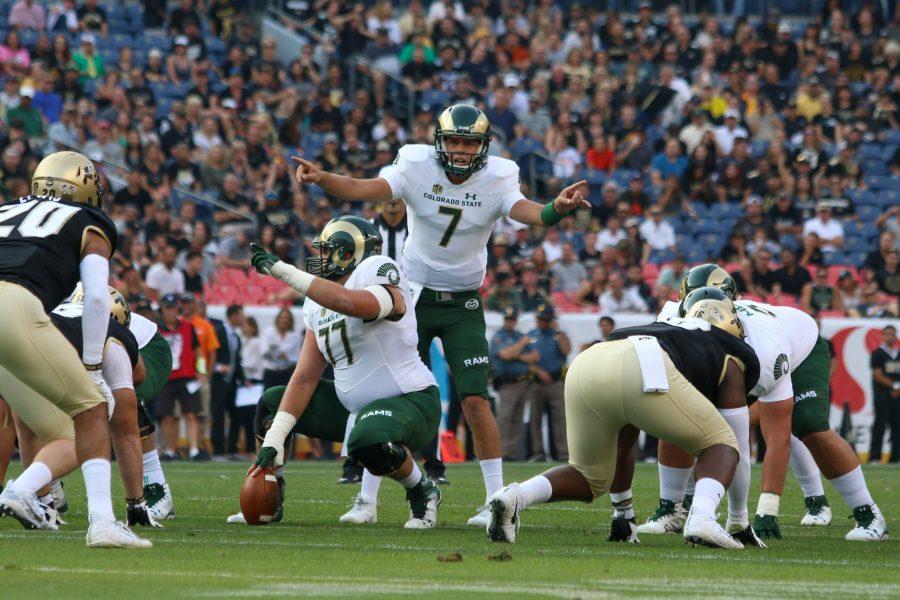 Quarterback Nick Stevens and center Jake Bennett direct players at the line of scrimage during the Rocky Mountain Showdown on Sept. 1, 2017 (Jack Stakebaum | Collegian).