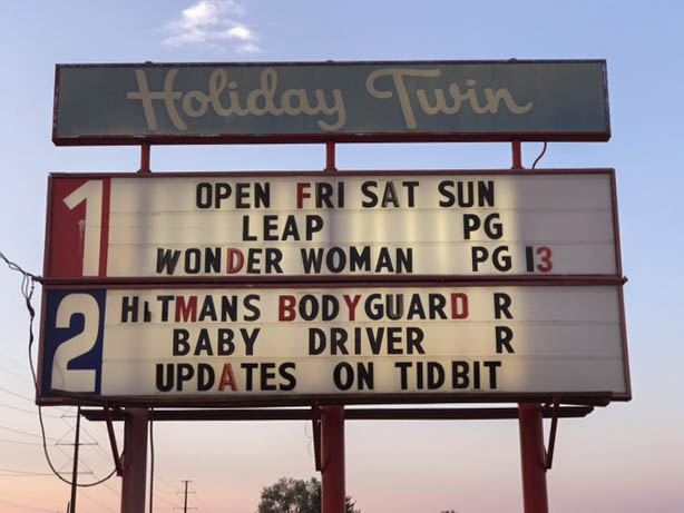 Title board showing the films playing at the drive-in.