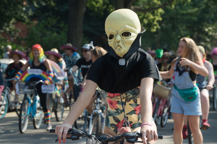 Many bizzare costumes were worn by Tour de Fat participants Saturday afternoon, including aliens in bodysuits. Photo by Olive Ancell | Collegian