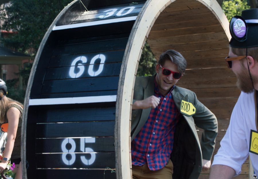 Rod from The Price is Right ran down the street in his giant game wheel Saturday in the parade. Photo by Olive Ancell | Collegian