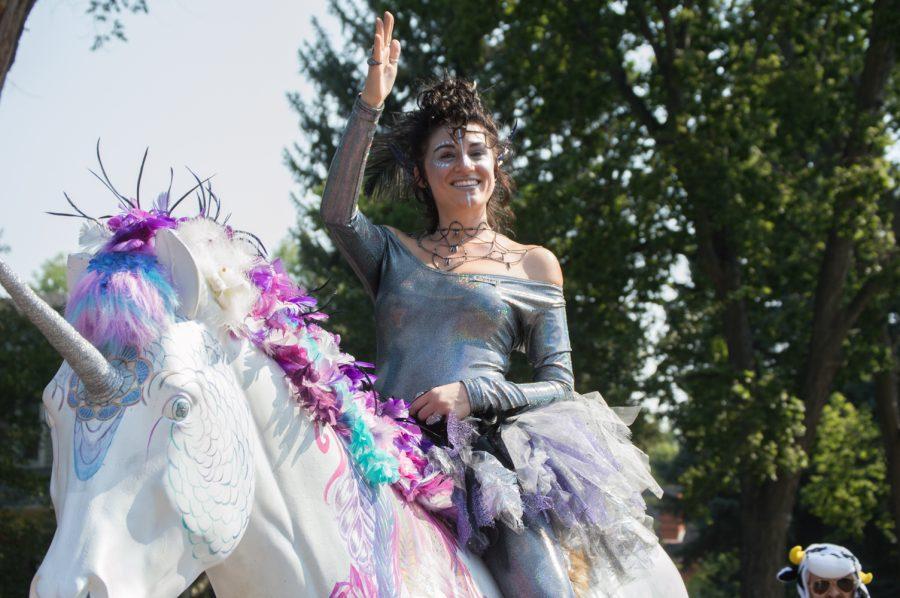 This Tour de Fat participant rode on a massive unicorn, waving to the people of the crowd Satuday afternoon. Photo by Olive Ancell | Collegian
