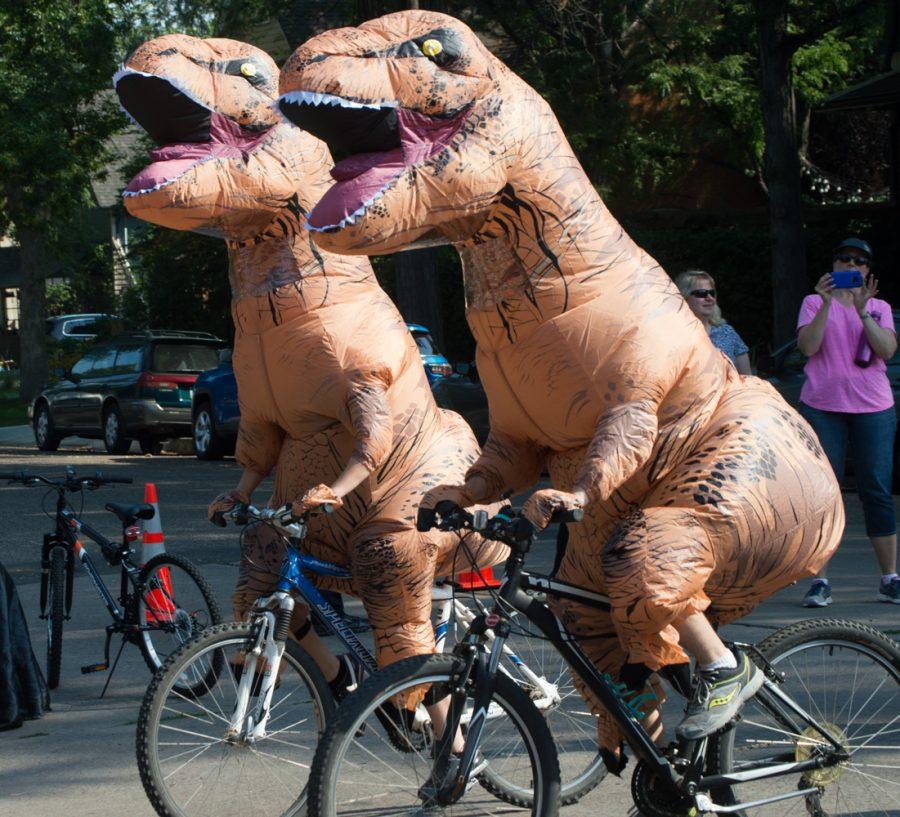 Tour de Fat would not be complete without a blow up T-Rex costume. This year, the festival was twice as lucky. Photo by Olive Ancell | Collegian