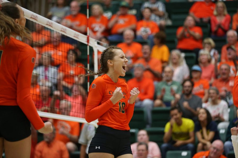 Senior Sanja Cizmic celebrates a kill with her teammates on Sept. 8 against the University of Michigan. The Rams defeated the Wolverines in three sets. (Elliott Jerge | Collegian)