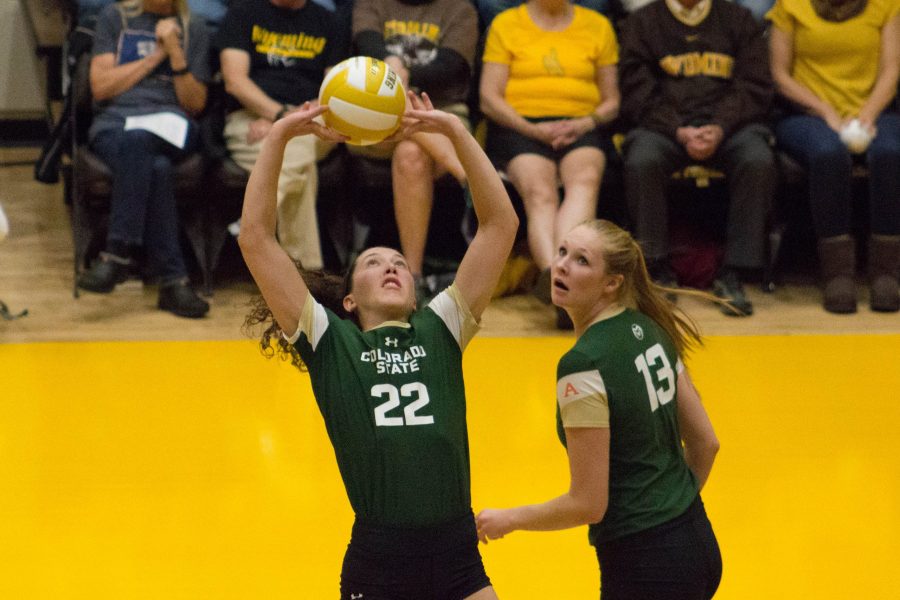 Setter, Katie Oleksak, back sets to middle blocker Kirstie Hillyer during the game against Wyoming on Sept. 26. The Rams swept the Cowgirls in three sets. (Ashley Potts | Collegian)