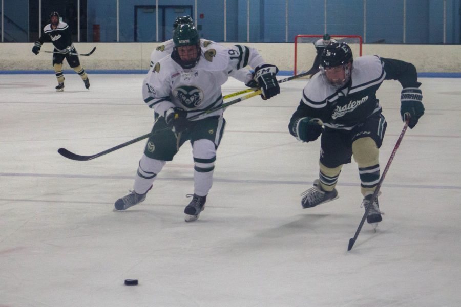 Forward Ben Joseph races an opponent for the puck during the Rams hockey game against Eastern Michigan on Friday night. The Rams lost 4-1. (Ashley Potts | Collegian)