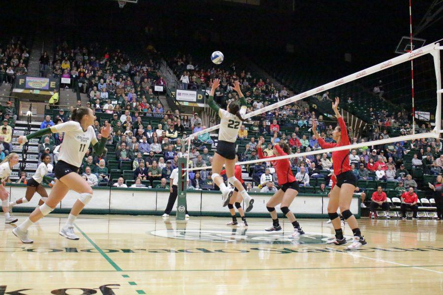 Sophomore, Katie Oleksak (22), sets the ball at the CSU vs. UNLV volleyball match in Moby Arena on Sept 23. (Jenny Lee | Collegian)