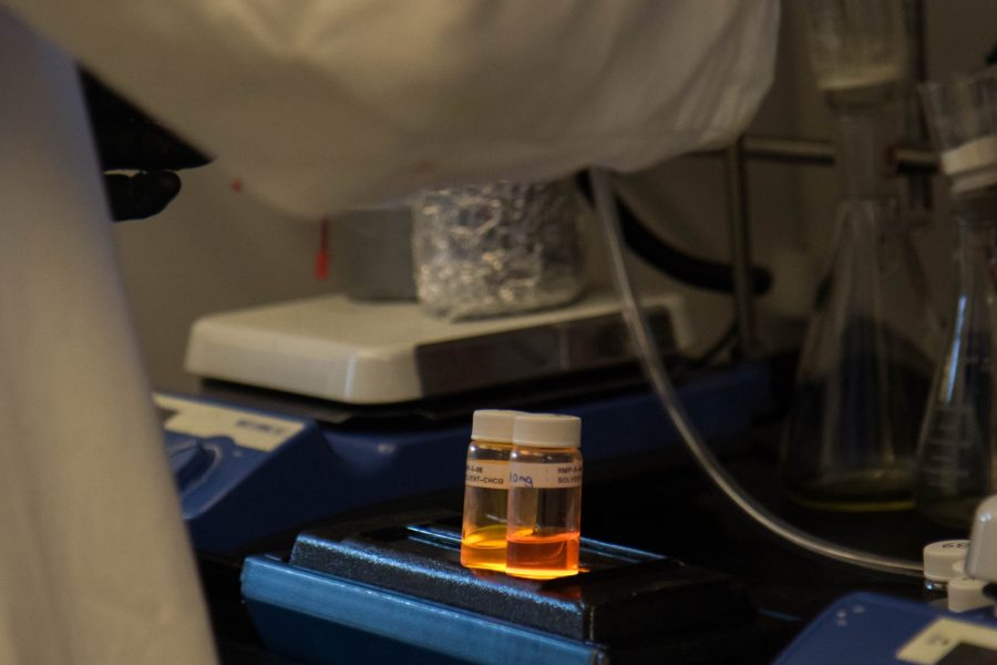 Fluorescent nanoparticles that were synthesized by the Miyake group at CSU sit under a fume hood. (Julia Trowbridge | Collegian)