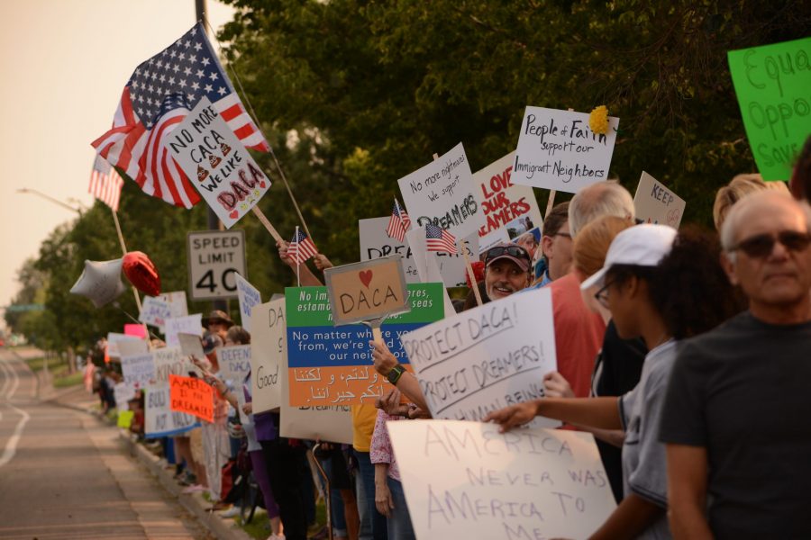 The turnout at the DACA solidarity rally is larger than expected as the community of Fort Collins brings their signs and their opinions to Senator Gardners front yard. (Maya Shoup | Collegian)
