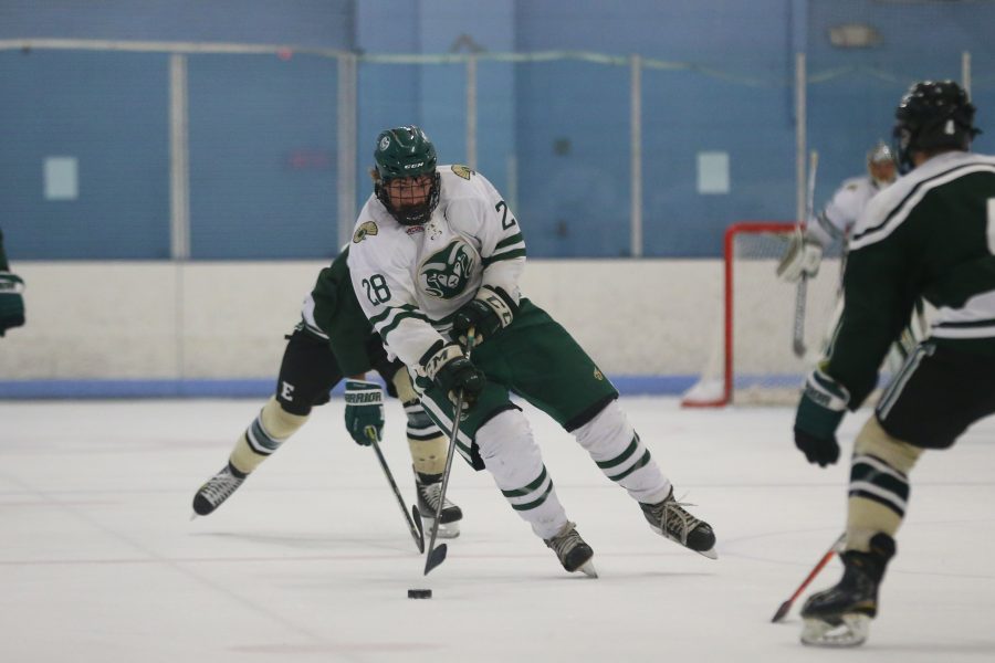 Forward Kyle Reilly moves the puck down the ice into  Eastern Michigan Territory on Sept 29 at the EPIC Center in Fort Collins. The Rams Hockey Team fell to the Eastern Michigan Eagles 4-1. (Elliott Jerge | Collegian)