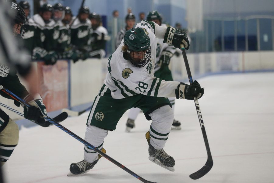Forward Kyle Reilly battles for the puck against an Eastern Michigan Defensemen on Sept 29 at the EPIC Center in Fort Collins. The Rams Hockey Team fell to the Eastern Michigan Eagles 4-1. (Elliott Jerge | Collegian)