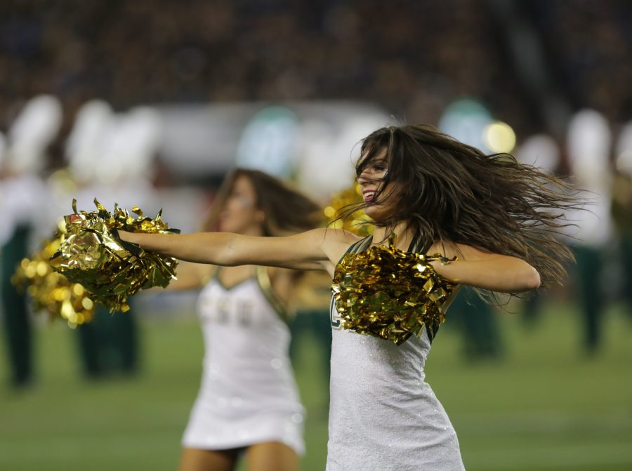 The Colorado State University cheerleaders perform for the crowd during the thrid quarter of the game on Friday night. (Forrest Czarnecki | Collegian)