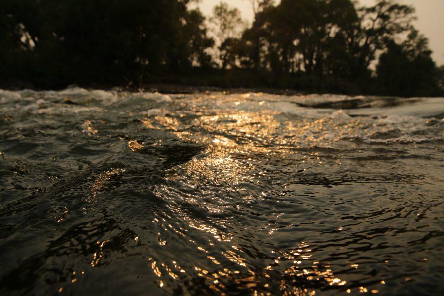 The Poudre River is pictured at sunset as it flows through Fort Collins. (Forrest Czarnecki | The Collegian)