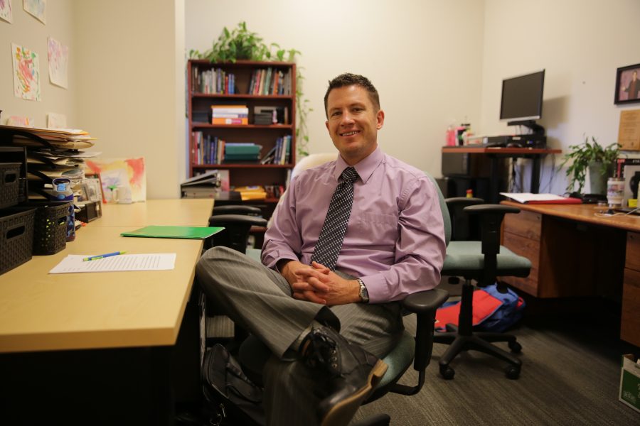 Colorado State University professor Kurt North poses for a portrait inside his office at the Behavioral Sciences building on Wednesday afternoon. North is a professor with the Department of Communication Studies at CSU. (Forrest Czarnecki | The Collegian)