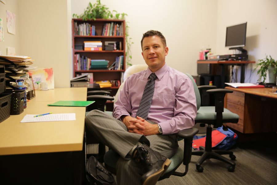 Colorado State University professor Kurt North poses for a portrait inside his office at the Behavioral Sciences building on Wednesday afternoon. North is a professor with the Department of Communication Studies at CSU. (Forrest Czarnecki | The Collegian)