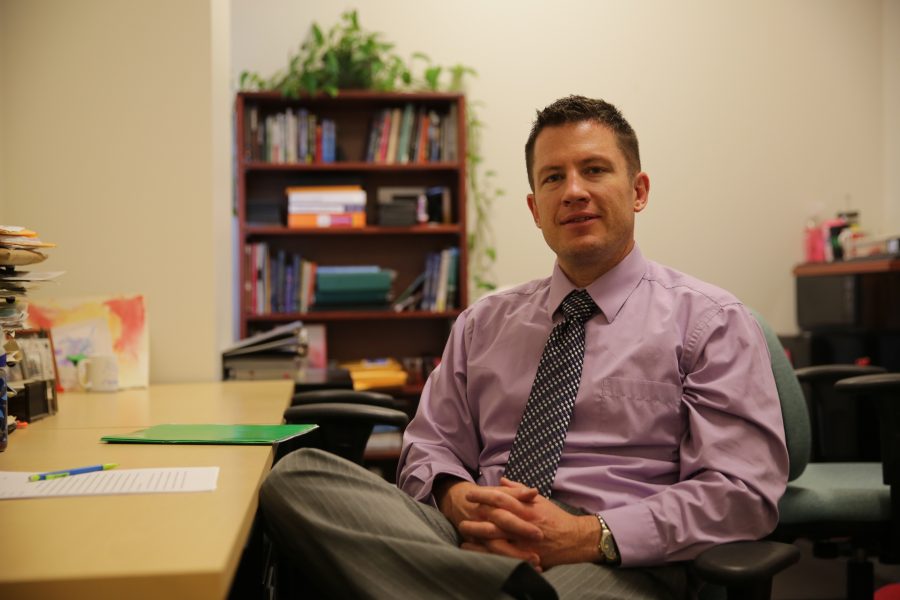 Colorado State University professor Kurt North poses for a portrait inside his office at the Behavioral Sciences building on Wednesday afternoon. North is a professor with the Department of Communication Studies at CSU. (Forrest Czarnecki | The Collegian)