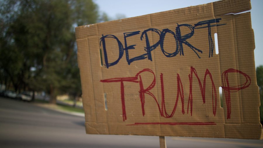 A sign that says Deport Trump held at the DACA Solidarity Rally. ( Tony Villalobos May | Collegian)
