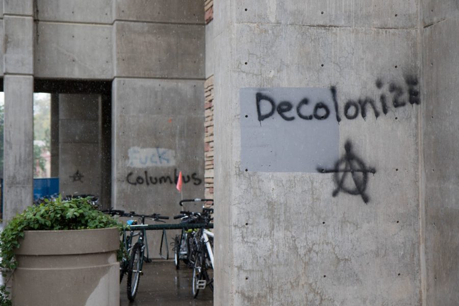 Decolonize, Fuck Columbus, and anarchy symbols are spray painted outside the Natural Resources building on Columbus Day 2017. (Julia Trowbridge | Collegian)