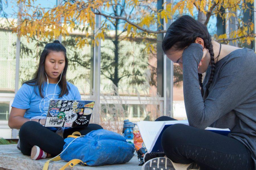 Aleesha bun, a biochemistry major, and Mia Salem, an engineering major, study for a calculus exam outside Morgan Library. Freshman year has taken full swing for them, as they tackle the stress head on. Photo by Olive Ancell | Collegian