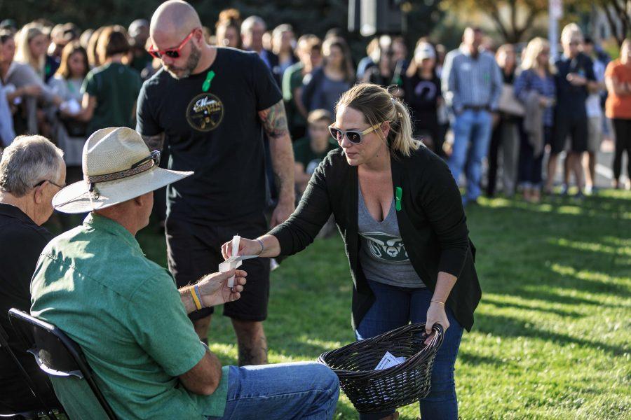 Friends, family and those close to Savannah help pass out candles during a vigil in her name hosted by the university. Savannah played an active role in both student media and external relations on campus. (Davis Bonner | Collegian)