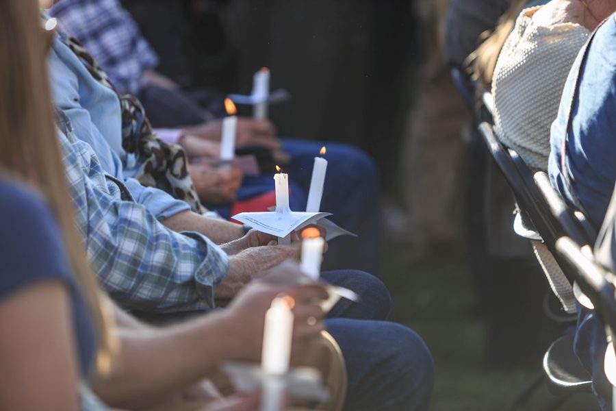 Those in attendance of Savannah McNealy's vigil hold candles in her memory. Savannah was an active member of the CSU community and was in her final semester of school. (Davis Bonner | Collegian)