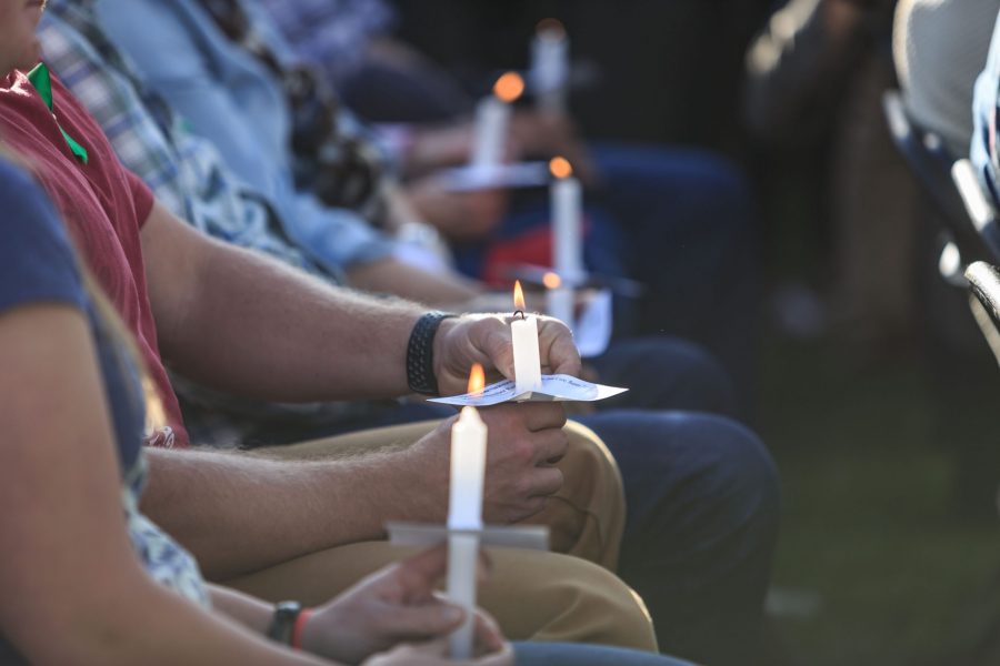 Those in attendance of Savannah McNealys vigil hold candles in her memory. Savannah was an active member of the Colorado State University community and was in her final semester at CSU. (Davis Bonner | Collegian)