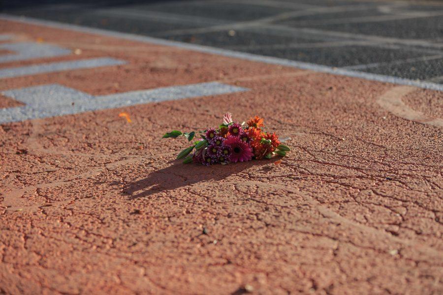 A bouquet of flowers is placed along Ram Walk next to the new CSU stadium in memory of Savannah McNealy. Savannah played a critical role in the creation of this football tradition during her time at the university. (Davis Bonner | Collegian)