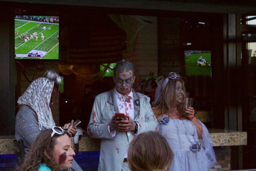 2017 Zombie Crawl participants sit at the Yeti Bar and Grill in Old Town Square. (Abby Flitton | Collegian)