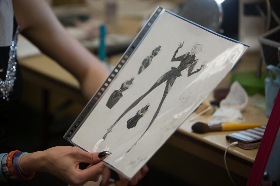 Fashion design major Luna Quartz shows off their final costume design made from scratch prior to the 2017 fall drag show hosted by PRSIM. (Davis Bonner | Collegian)