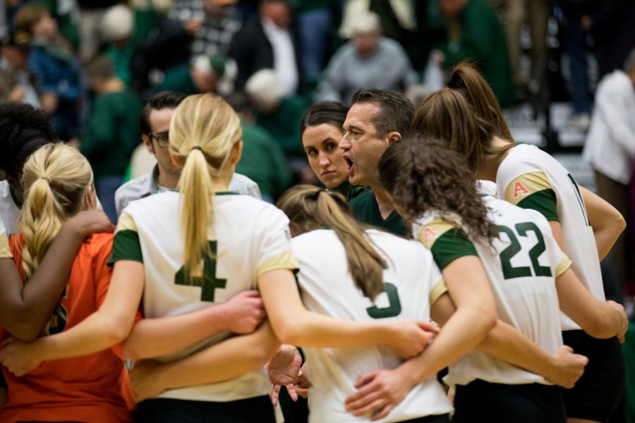 CSU head volleyball coach Tom Hilbert talks to the players after the game against the Air Force Academy. (Jordan Reyes | Collegian)