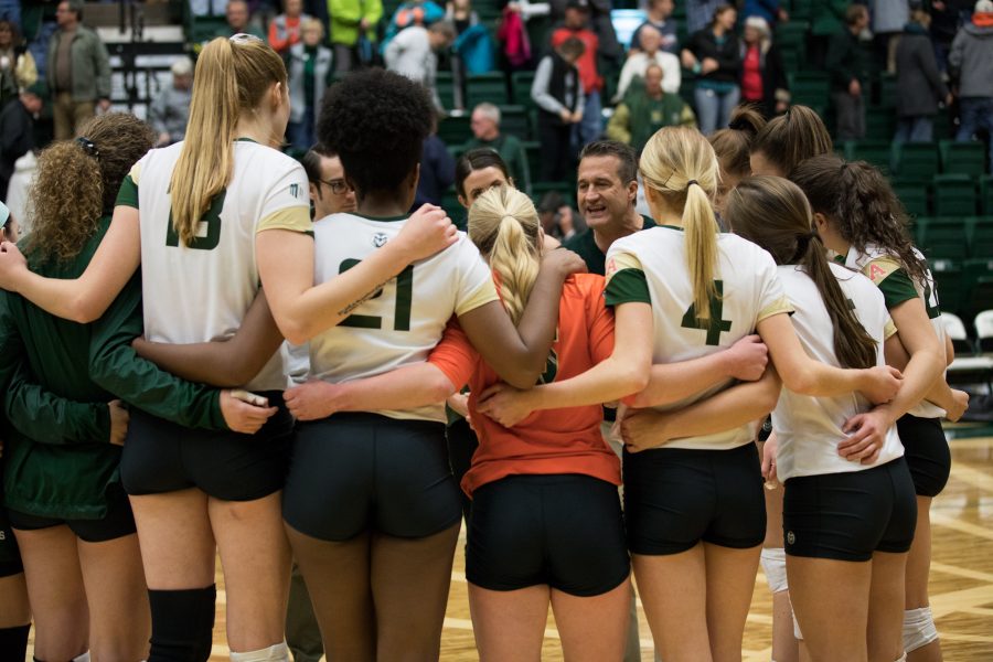 CSU head volleyball coach Tom Hilbert talks to the players after the game against Air Force. (Jordan Reyes | Collegian)