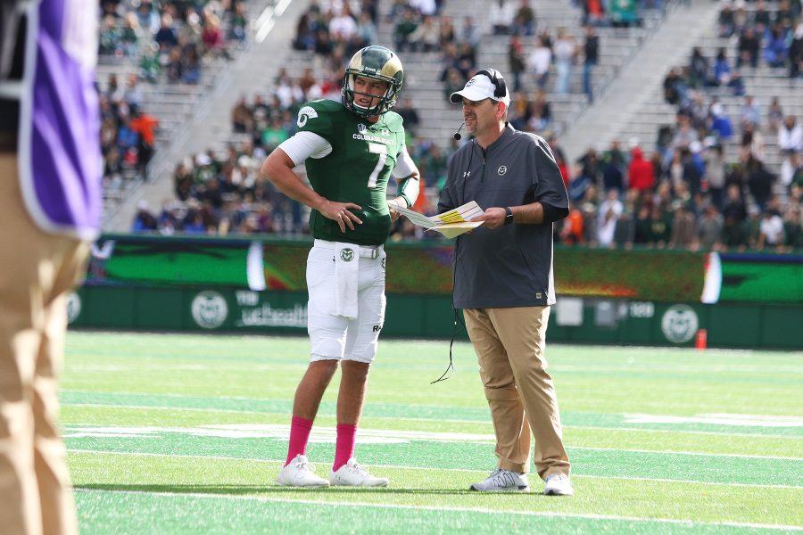 Senior quarterback Nick Stevens (7) and head coach Mike Bobo discuss plays during the first half of the Rams 28-45 loss against Air Force. (Javon Harris | Collegian)
