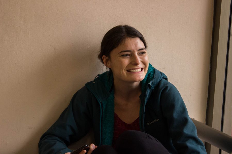 First year electrical engineering graduate student Lydia Rush smiles as she thinks about her favorite holiday movie. Her favorite movie to watch around the upcoming holidays is the newer How The Grinch Stole Christmas. (Jenna Van Lone | Collegian)