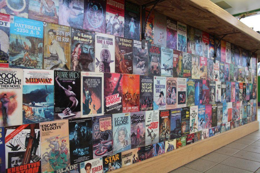 The front counter at Bizarre Bazaar, a local record and book store on College Avenue is covered in old book.
 (Matt Begeman | Collegian)