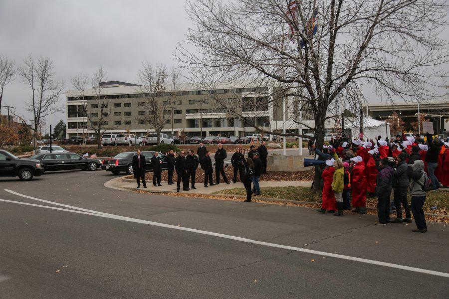 US Vice President Mike Pence arrives at the Denver Marriott Tech Center where he is to speak at a Republican Party fundraiser. Protestors dressed as handmaids in reference to the popular television show Handmaids Tale that describes a world in which women are considered property. (Davis Bonner | Collegian)