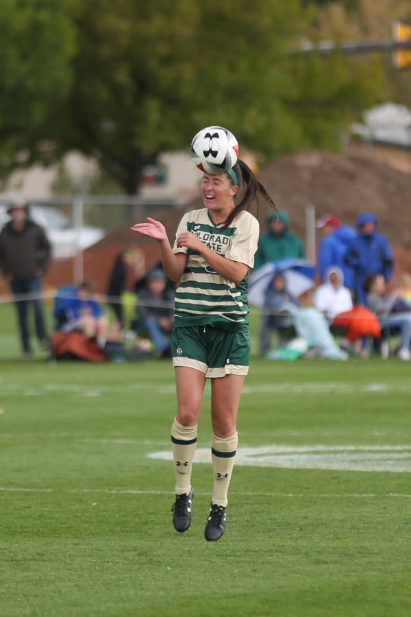 Defender Makenzi Taylor heads a ball out of the air during second half of action against the Fresno State Bulldogs on Oct 1. (Elliott Jerge | Collegian)