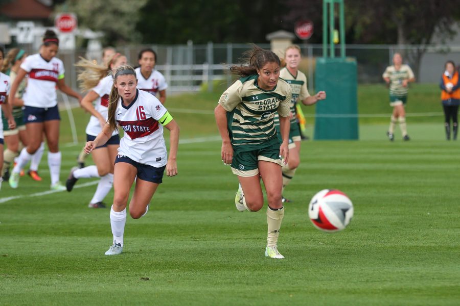 Defender Lexi Swenson races a Fresno State Defender to a loose ball during the second half of action on Oct 1. (Elliott Jerge | Collegian)