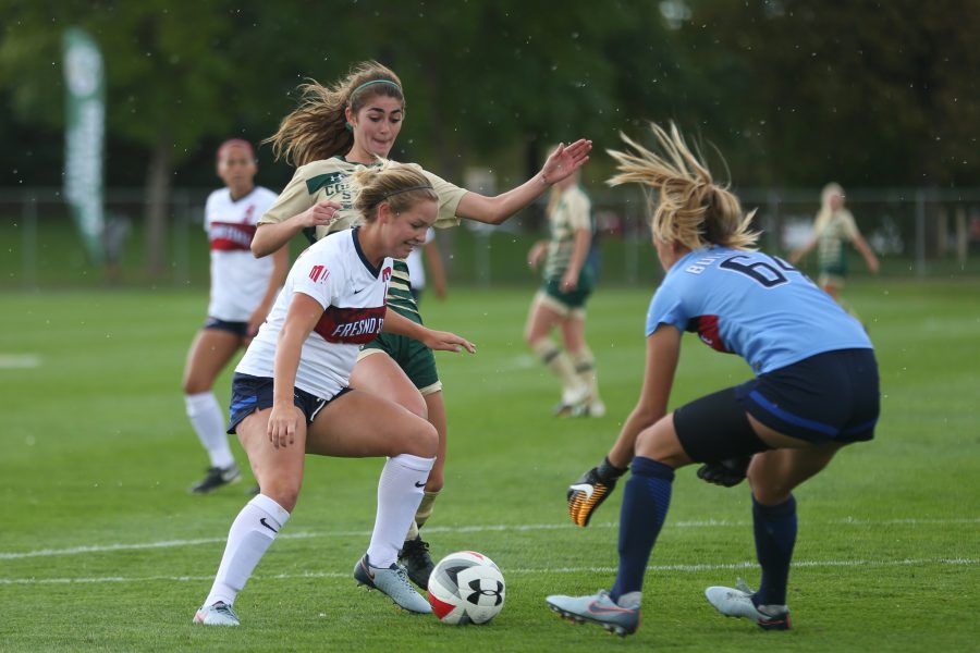 Forward Taylor Steinke battles for the ball against a Fresno State defender and Goalie during the first half of action on Oct 1. The Rams are currently 2-5-4 on the season. (Elliott Jerge | Collegian)