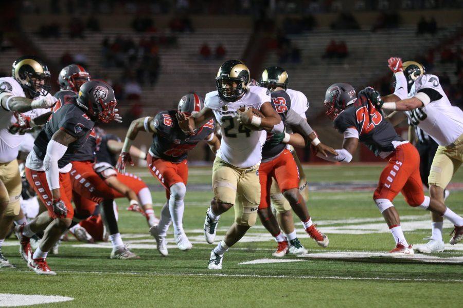 Colorado State running back Izzy Matthews finds a hole in the New Mexico defense during the third quarter of action on Oct 20. The Rams defeated the Lobos 27-24 and advanced to 6-2 overall. (Elliott Jerge | Collegian)