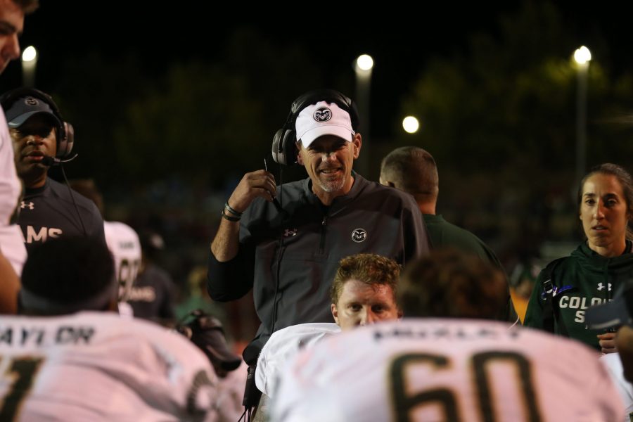 Colorado State head coach Mike Bobo talks to his team after scoring a touchdown during the second quarter of action against the University of New Mexico on Oct 20.  (Elliott Jerge | Collegian)