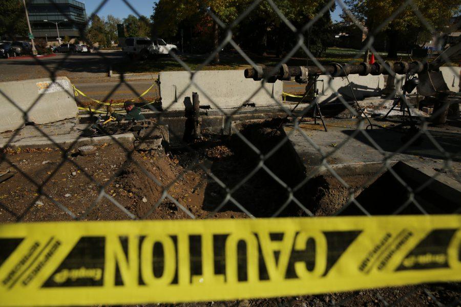 Construction workers and equipment is pictured along West Plum Street near the Colorado State University Transit Center on Tuesday morning. Workers were replacing and rerouting a condensation line underneath the roadway. (Forrest Czarnecki | The Collegian)
