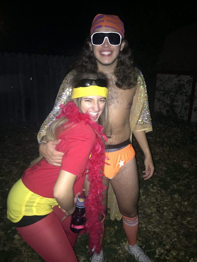 Junior Political Science major Cybil Lapenna and Junior Music major Parker Walters dress up as 80s wrestlers for Halloween weekend. (Miranda Moses | Collegian)
