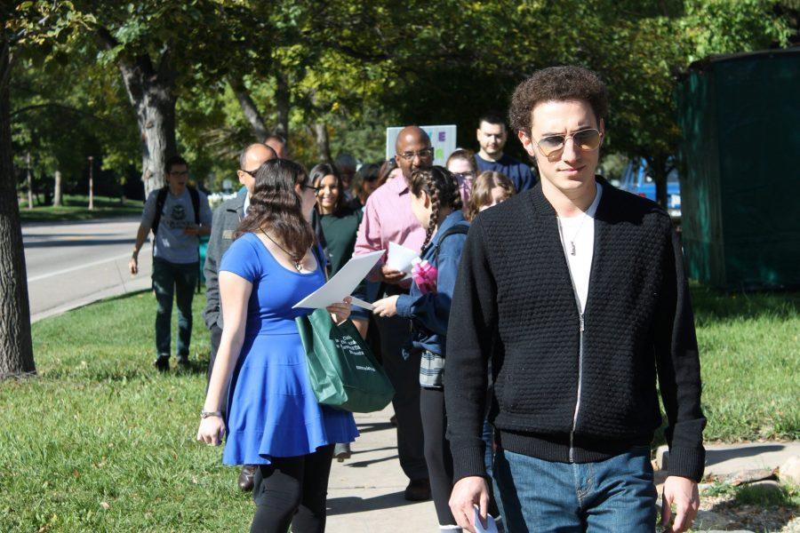 Alex Amchislavskiy, Colorado State University campus director of CSU Hillel marches to the Lory Student Center with other community members. Amichslavskiy helped planned the event after CSU student Hannah Kramer, a freshman biochemistry major, told him she found the words