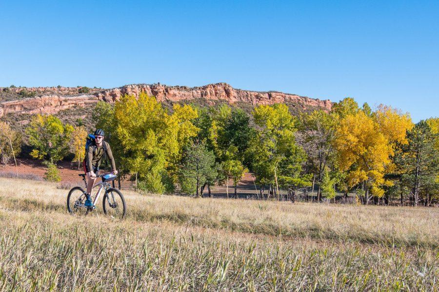 Josiah Cuckler, a senior nutrition and dietetics major at CSU, is shown riding a popular trail in Lory State Park. (Michael Berg | Collegian)