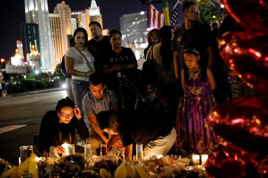 People visit and pay their respects at a makeshift memorial for the victims of the recent mass shooting, on Reno Ave and Las Vegas Blvd. on Oct. 3, 2017 in Las Vegas. (Marcus Yam / Los Angeles Times/TNS)