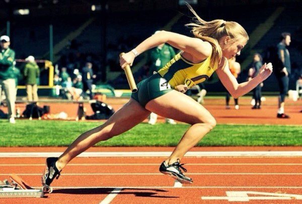 Marybeth Sant begins her portion of a 4x100 relay at the University of Oregon. (Photo courtesy of Marybeth Sant)